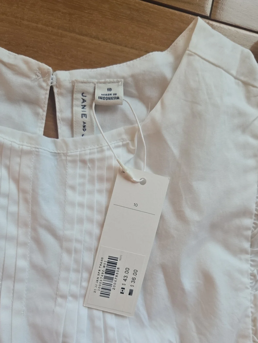 Janue And Jack Girls White Ruffle Trim Sleeveless Top with Navy Accent